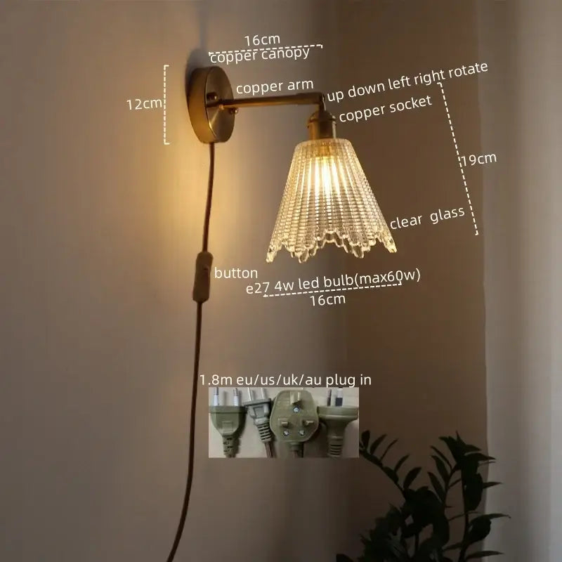 Copper-finished modern brass and crystal led wall lamp with clear glass shade and cascading crystal prisms for bedroom use