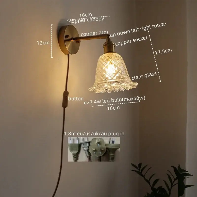 Modern brass and crystal led wall lamp with copper finish and clear etched glass shade for bedroom use