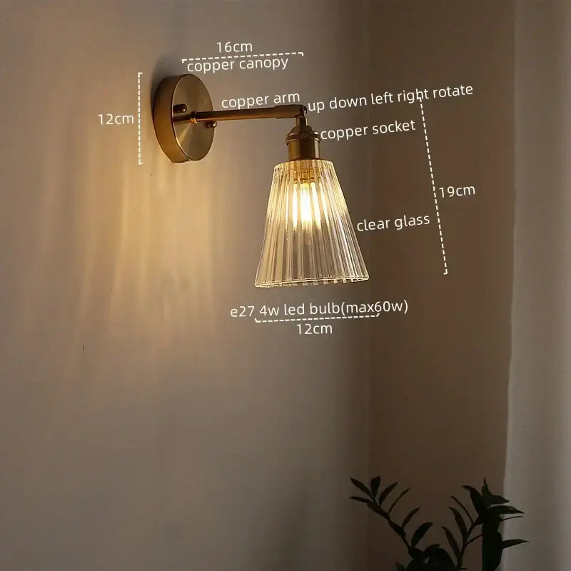 Modern brass and crystal led wall lamps with copper finish and clear fluted glass shade for bedroom lighting