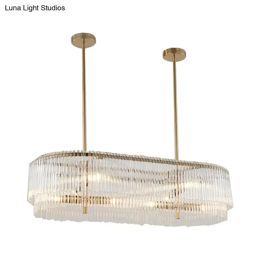 Gold-toned decorbites 12-light brass crystal rod island lamp with clear glass prisms in modern elongated oval design