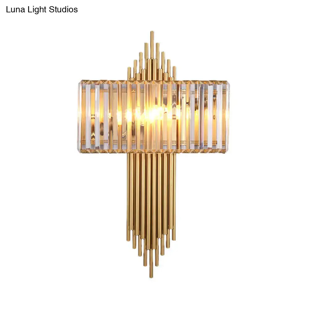 Modern brass and crystal rectangular wall lighting fixture with gold-toned vertical crystal rods and warm glow for bedroom