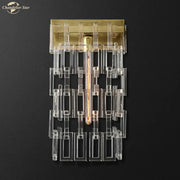 Modern brass and crystal wall sconce with clear acrylic geometric bars and exposed filament bulb for living room decorbites crystal wall