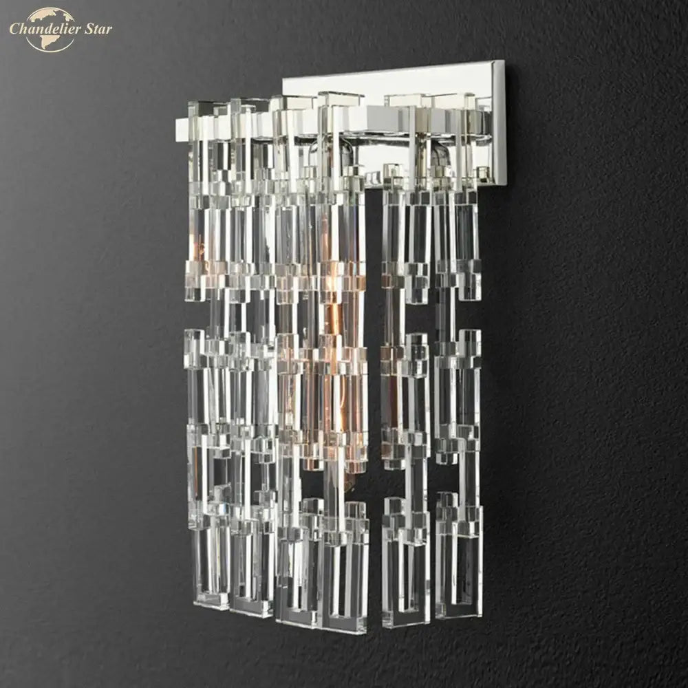 Modern brass and crystal wall sconce with sleek chrome finish and cascading clear glass tubes decorbites crystal wall lighting