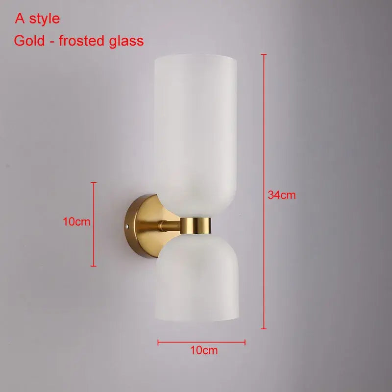 Modern brass wall lamps with gold finish and two frosted decorbites glass ball shades for bedroom sconces