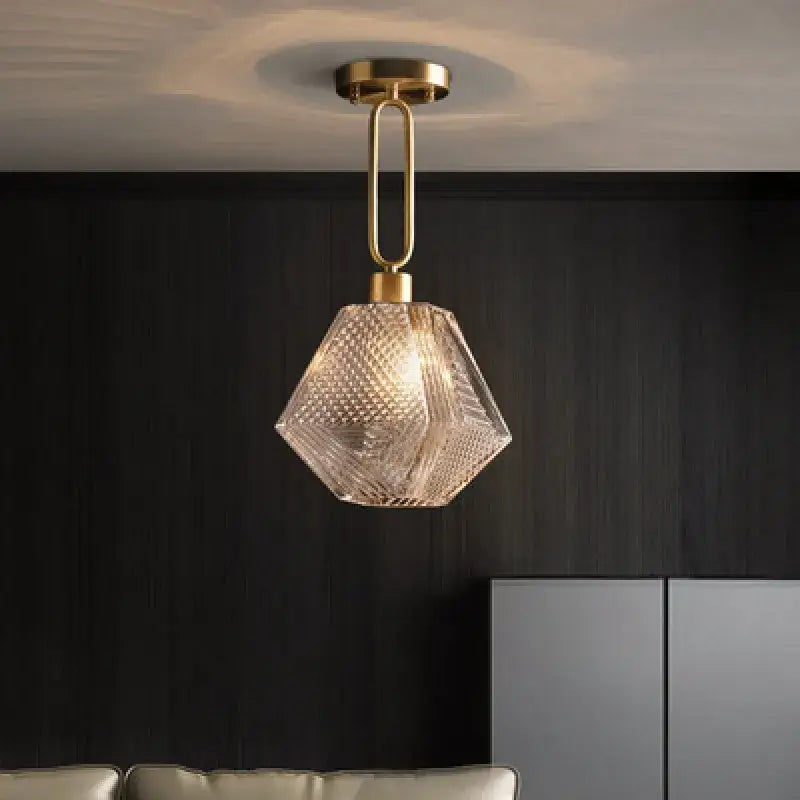 Modern brass and diamond glass pendant lamp featuring a faceted glass pendant lamp for living room lighting