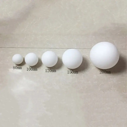 Modern brass and frosted glass ball pendant light featuring white spherical foam balls in sizes 80mm to 200mm decorbites glass ball pendant