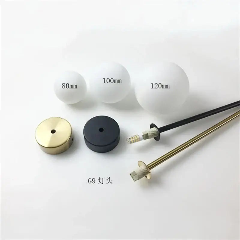 Set of three modern brass and frosted glass ball pendant lights with g9 lamp bases for kitchen lighting decorbites glass ball