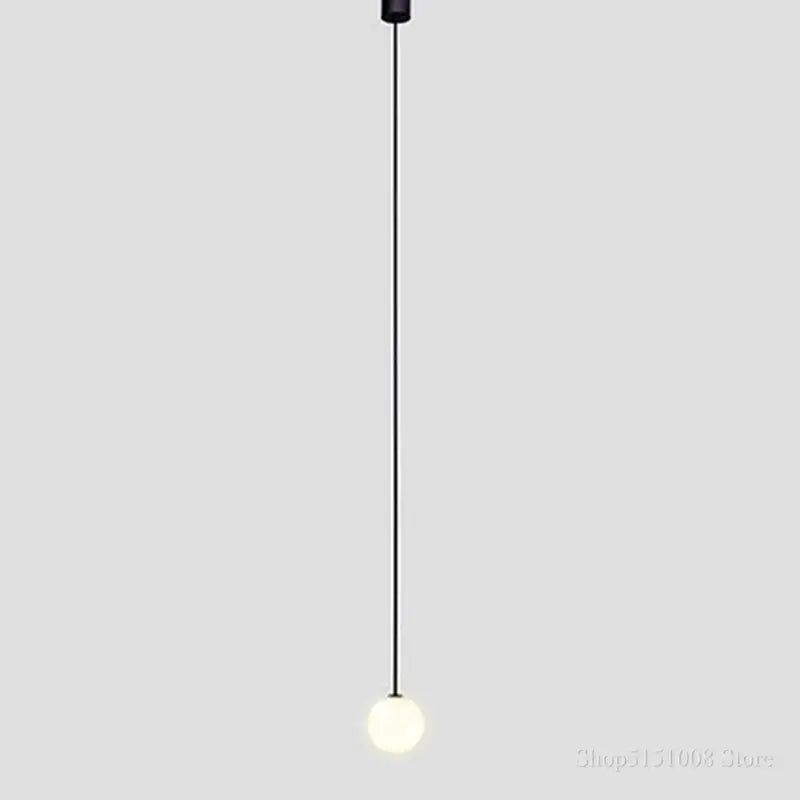 Minimalist black pendant light with a sleek spherical frosted glass ball pendant from decorbites glass ball collection
