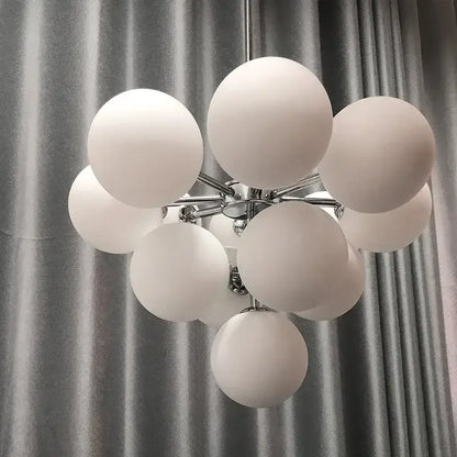 Modern brass and frosted glass chandelier with white frosted globe and chrome frame for living room decorbites elegant glass chandelier