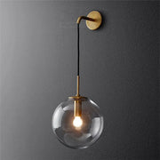 Modern brass and glass ball wall lamp with brass finish and clear glass globe for bedroom decorbites glass ball lighting