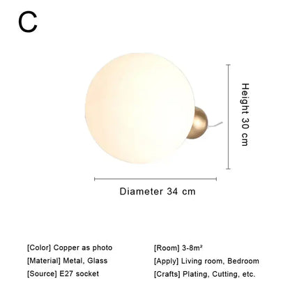 Modern brass and glass desk lamp with spherical frosted glass shade and copper base for bedroom decorbites glass desk use