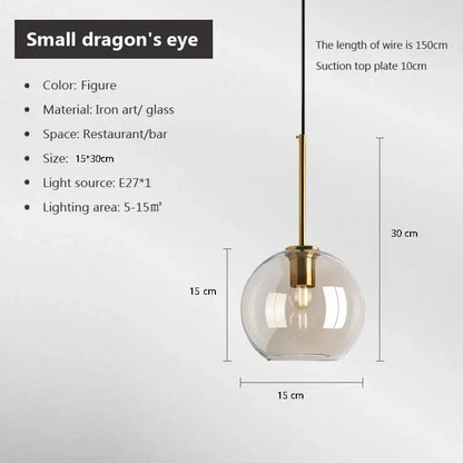 A sleek spherical glass pendant light with brass iron finish and e27 bulb for cord pendant installation