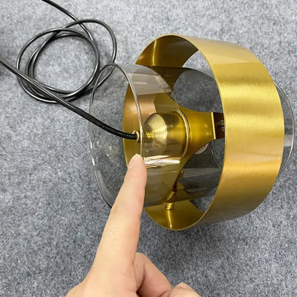 Modern brass and glass pendant light with brushed gold frame clear glass pendant and exposed bulb for kitchen or dining room