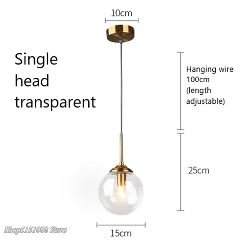 Modern brass and glass pendant lights featuring a transparent glass pendant with gold-toned fixture for kitchen dining room