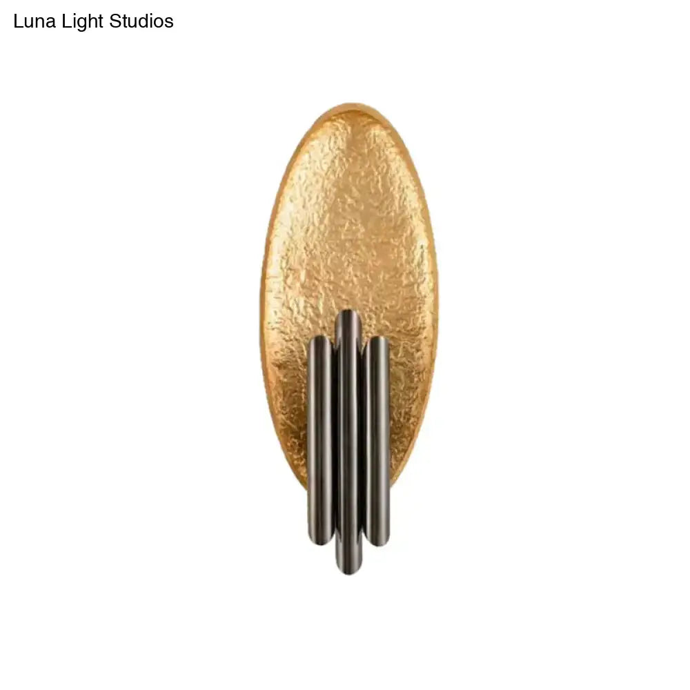 Modern brass and glass wall light with gold-toned oval sconce and four vertical matte black rods with e12 e14 base