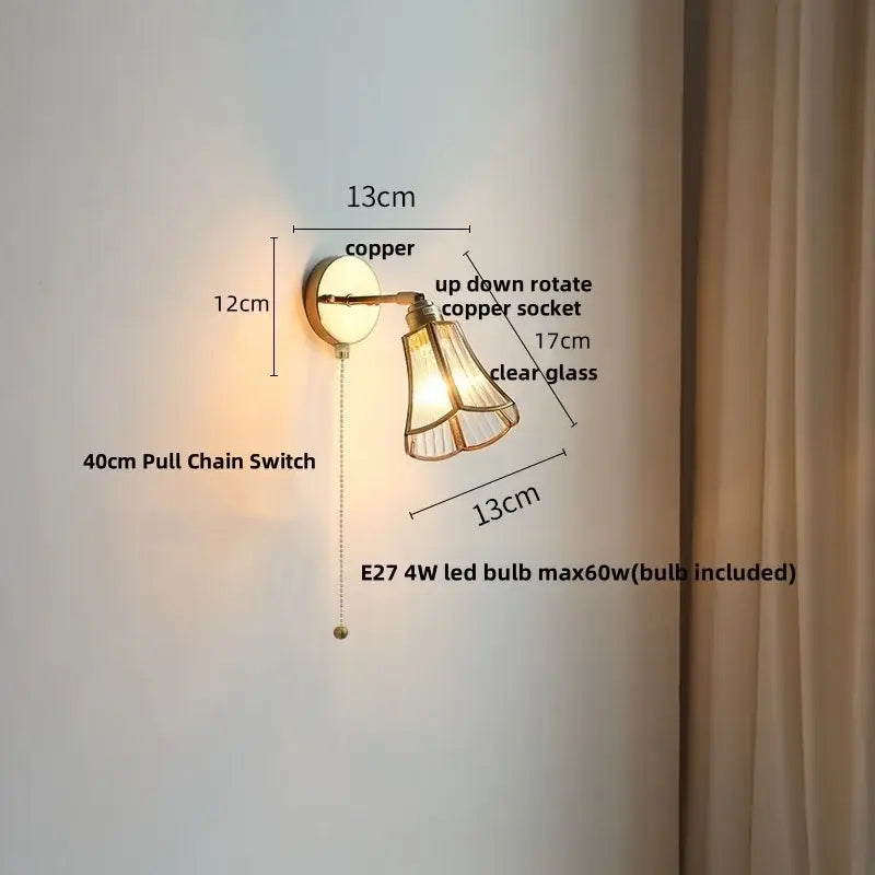 Modern brass and gray glass led wall sconce with copper up-down rotating socket and clear glass shade for bedroom lighting