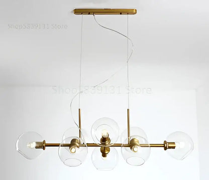 Modern brass pendant lights with gray glass pendant globes and gold toned five bulb chandelier for kitchen dining room