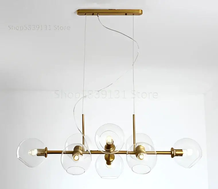 Modern brass pendant lights with gray glass pendant globes and gold toned five bulb chandelier for kitchen dining room