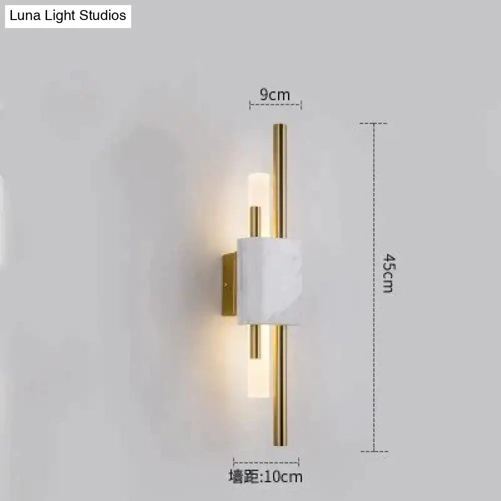 Modern brass and green marble led wall lamp featuring a minimalist white marble center with gold-toned metal rods