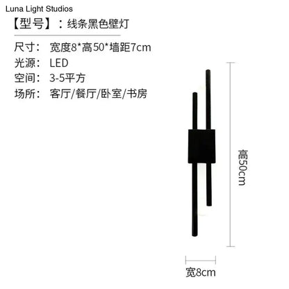 Modern marble led wall lamp featuring black minimalist rods and a brass green marble base for living room