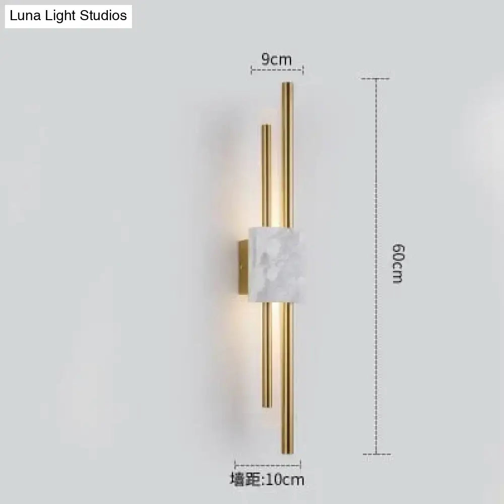 Modern brass and green marble led wall lamp with gold-toned rods and white marble accent for living room lighting