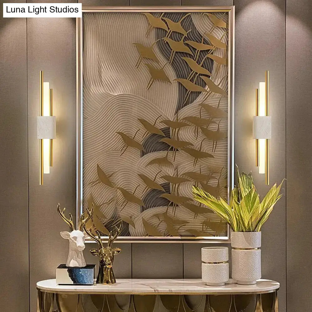 Modern brass and green marble led wall lamp with gold-toned sculptural wave art and bird silhouettes for living room