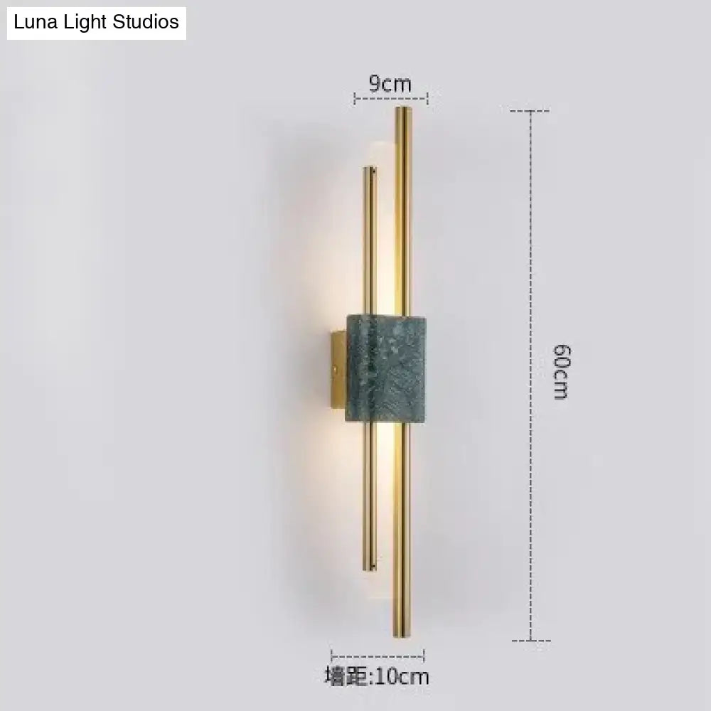 Modern brass and green marble led wall lamp with slender gold-toned rods and dark green marble accent for living room