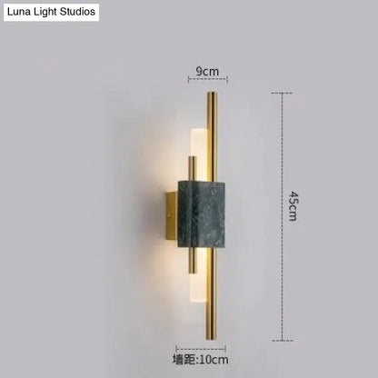 Modern brass and green marble led wall lamp featuring a sleek gold frame and frosted glass diffuser for living room