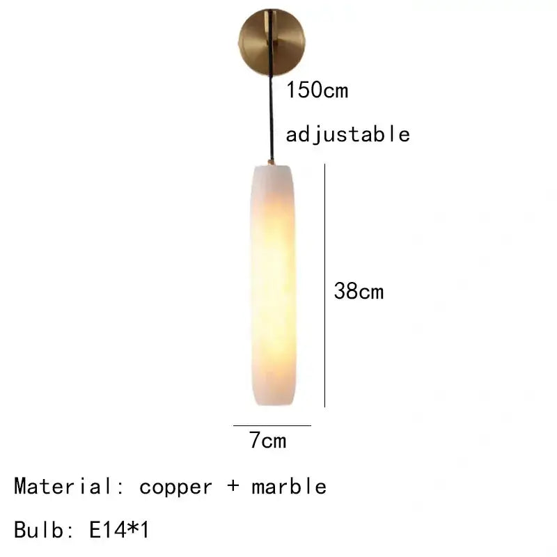 Modern brass and marble wall lamp bedroom sconce with a warm glow featuring decorbites cylindrical marble design