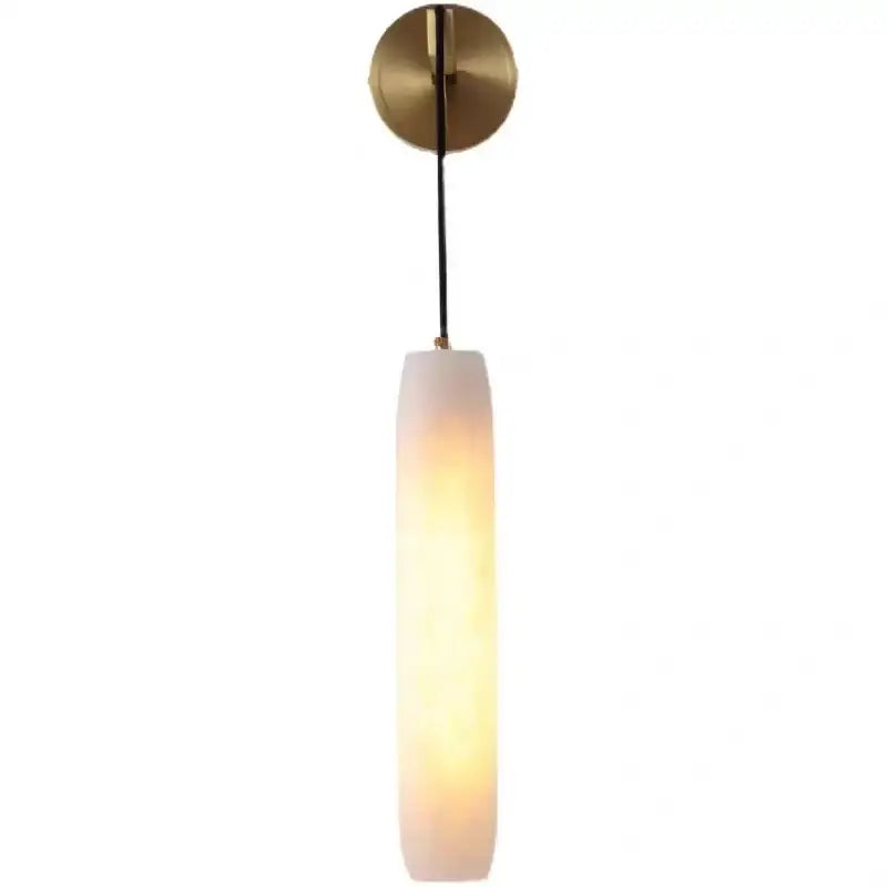 Modern brass and marble wall lamp with decorbites cylindrical frosted glass shade providing warm bedroom sconce lighting