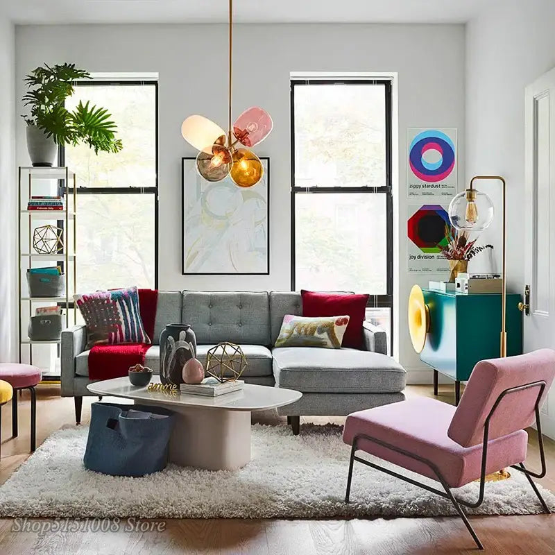 Modern brass and multi color glass pendant light with translucent pink amber and gold orbs for dining room use