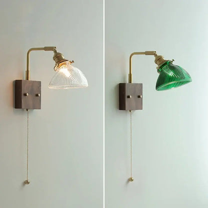 Modern brass wall lights with ribbed clear glass shade mounted on a dark wood base for bedroom decorbites clear glass