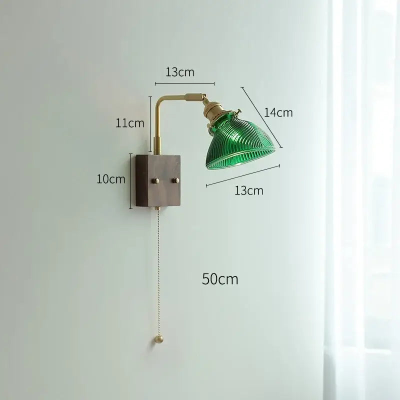 Modern brass wall light with green ribbed clear glass lampshade on dark wood base by decorbites clear glass