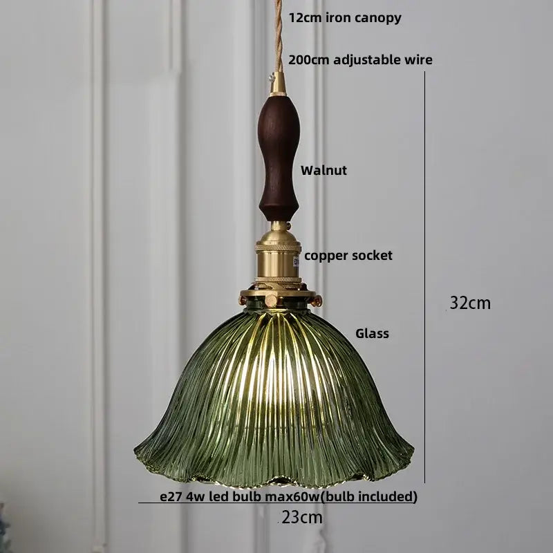 Vintage-style pendant light with dark walnut iron canopy, brass knob switch, and olive-green ribbed glass shade decorbites clear glass