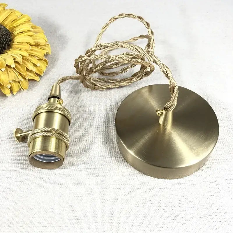 Modern brass pendant light with knob switch and decorbites clear glass featuring twisted beige fabric cord and ceiling mount