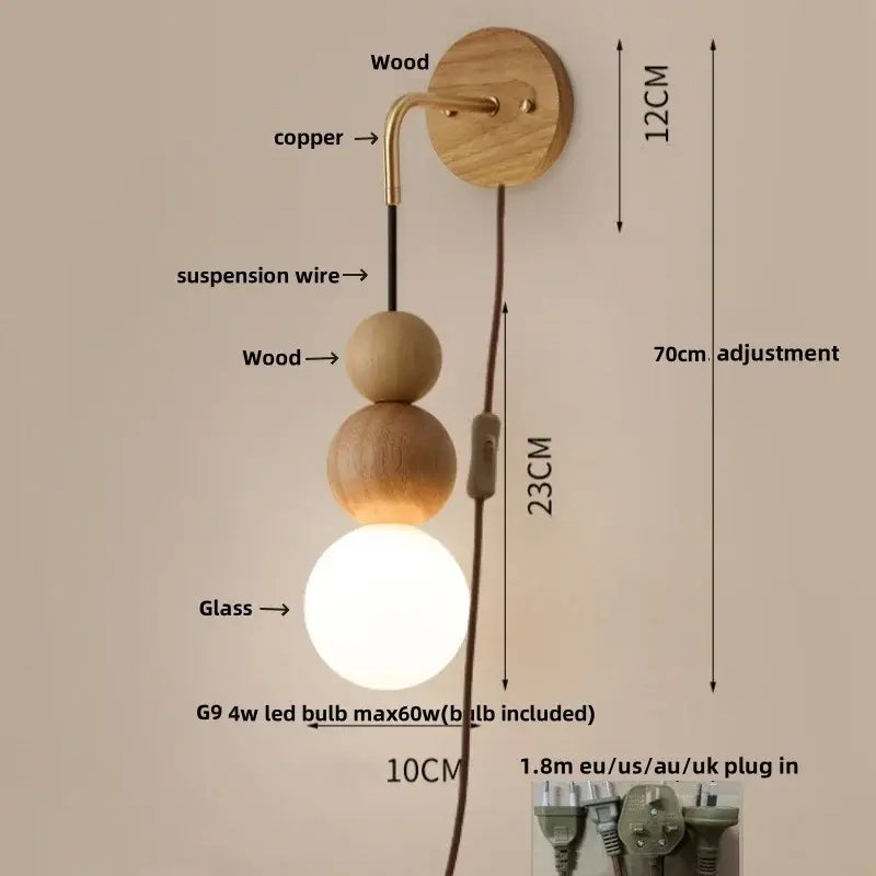 Modern brass and walnut wood wall sconce with adjustable copper arm, walnut wood base, and glowing sphere bulb decorbites wall sconce