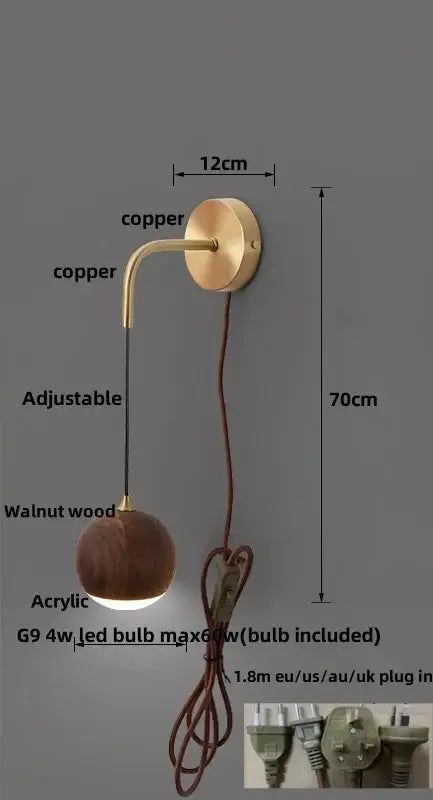 Modern brass and walnut wood wall sconce with adjustable arm and spherical acrylic lampshade for versatile lighting decorbites