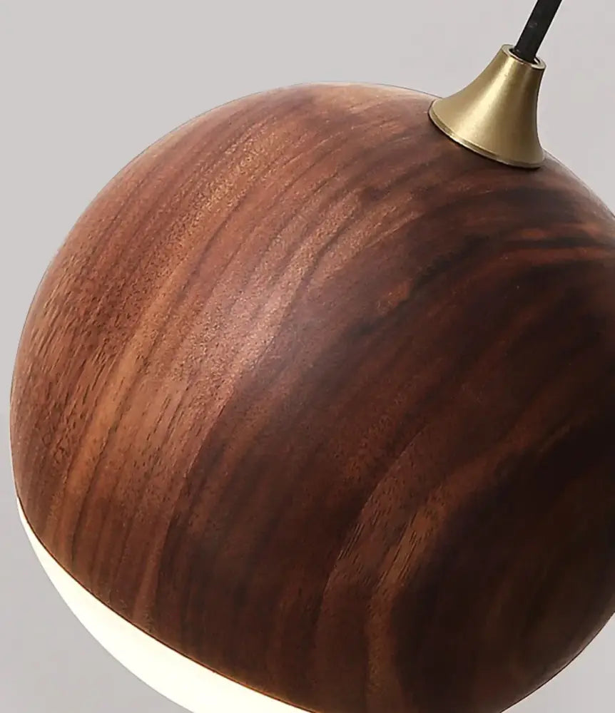 A modern brass and walnut wood wall sconce with a sleek round pendant light and warm brown finish for bedroom decorbites adjustable walnut