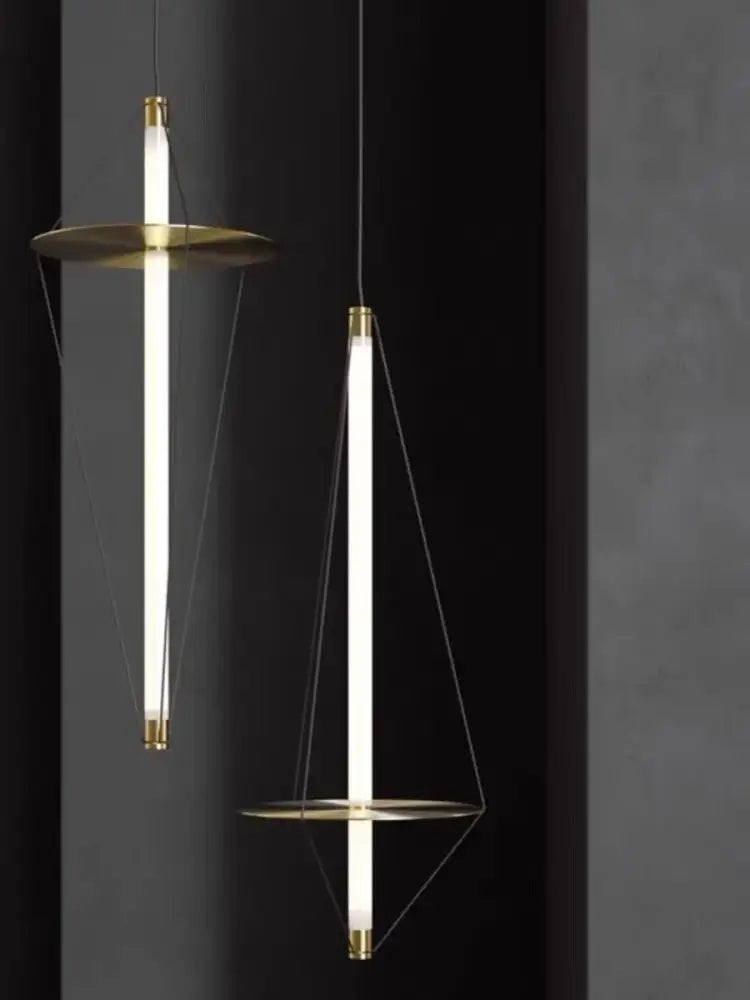 Modern brass and white led disc pendant light with slender glowing tubes for elegant bedroom decorbites disc pendant lighting