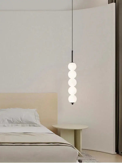 Minimalist modern brass and led white pearl pendant lights with five stacked frosted glass spheres for kitchen decorbites