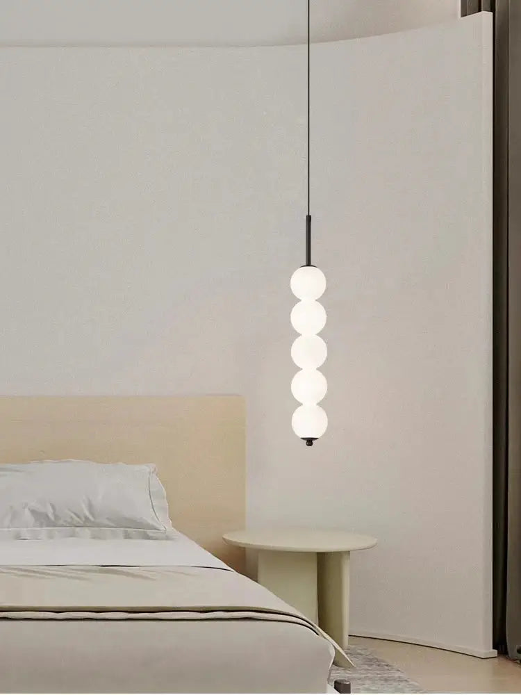 Minimalist modern brass and led white pearl pendant lights with five stacked frosted glass spheres for kitchen decorbites