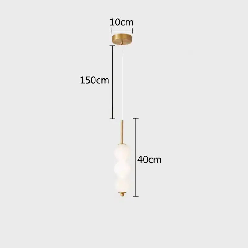 A modern brass and white pearl led pendant light with three frosted glass orbs for kitchen decorbites led white lighting