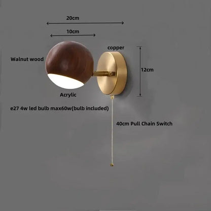 Modern brass and wood base wall sconce with walnut wood and copper finish featuring a spherical acrylic diffuser for decorbites led wood