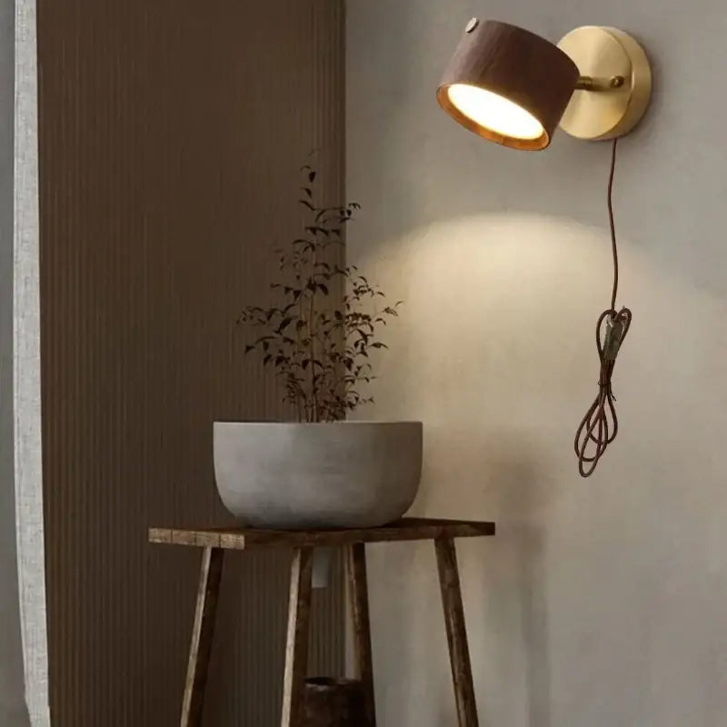 Modern brass and wood base wall sconce with warm-toned cylindrical spotlight for living room decorbites led wood lighting