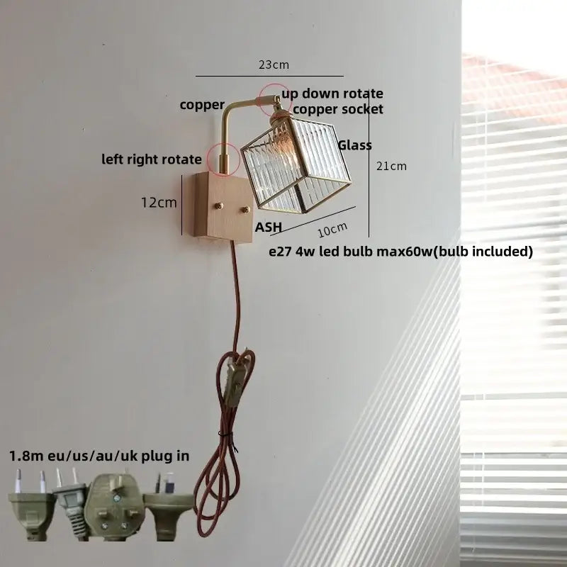 Modern wall lights with copper-finished arm and clear glass cube shade featuring led bulb for bedroom use