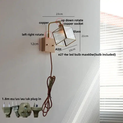 Modern wall lights with copper-finished arm and clear glass cube shade featuring led bulb for bedroom use