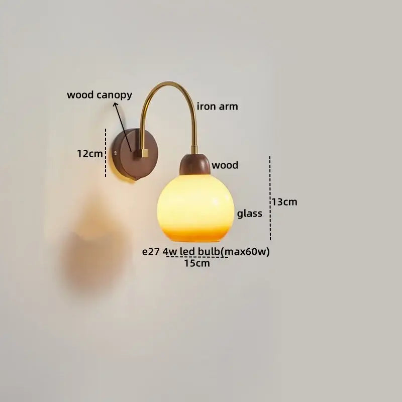 Modern brass and wood led wall sconce with warm-toned glass globe and pull chain for bedroom decorbites led wall lighting