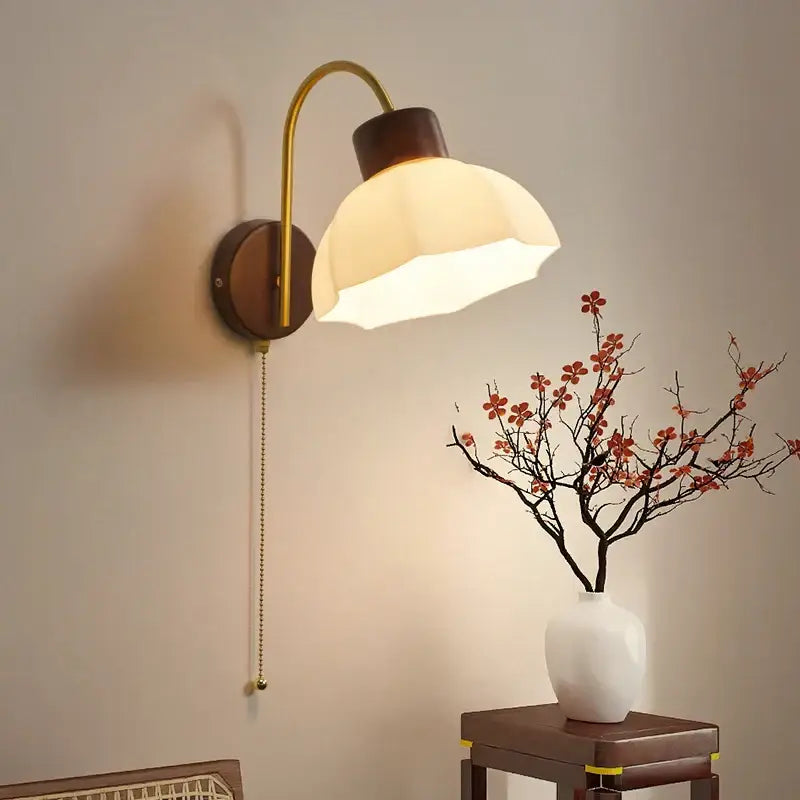 Modern brass and wood led wall sconce pull chain with warm brass finish dark wood base and off-white fabric shade for bedroom decorbites led wall