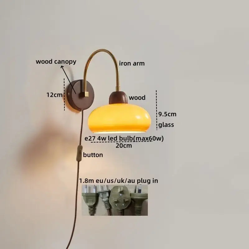 Modern brass and wood led wall sconce with warm yellow glass lamp and curved brass arm for bedroom decorbites led wall light