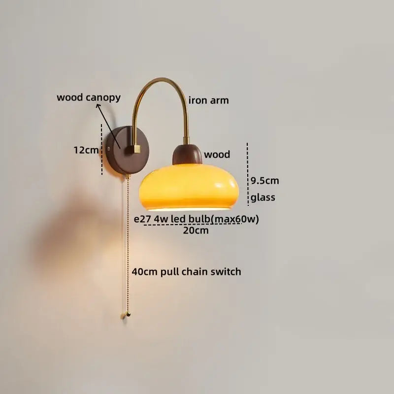Modern brass and wood led wall sconce with warm yellow glass lampshade and wall sconce pull chain for bedroom decorbites led wall